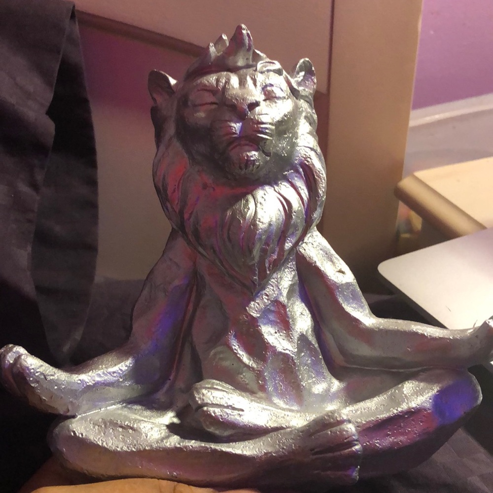 Meditating lion statue